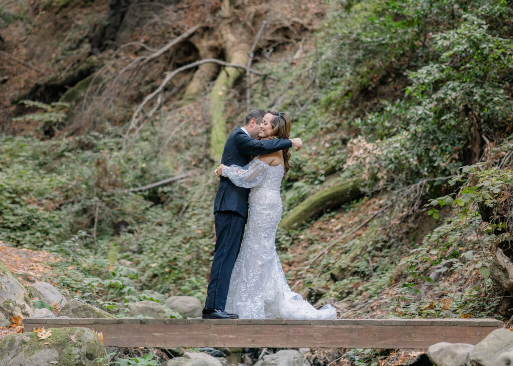 A bride and groom embrace at their first look at Saratoga Springs